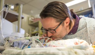 dad sings to dying newborn baby